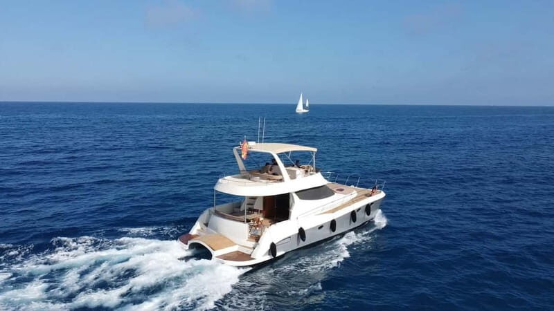 Puerto del Carmen: Private Sunset Catamaran Tour with Drinks - Chasing the light near Los Ajaches and the Peñas del Chache view